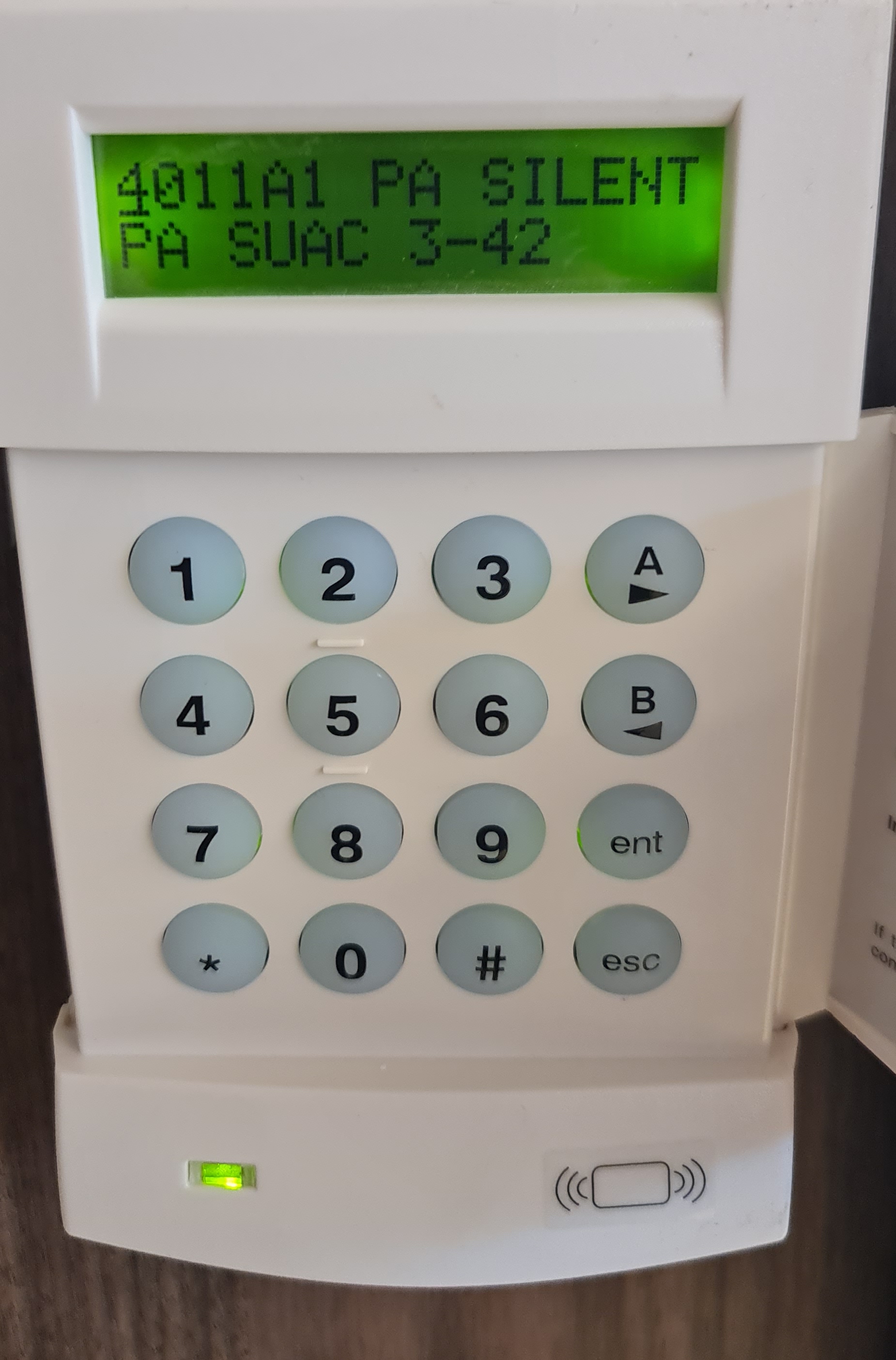 Intruder alarm keypad on a wall