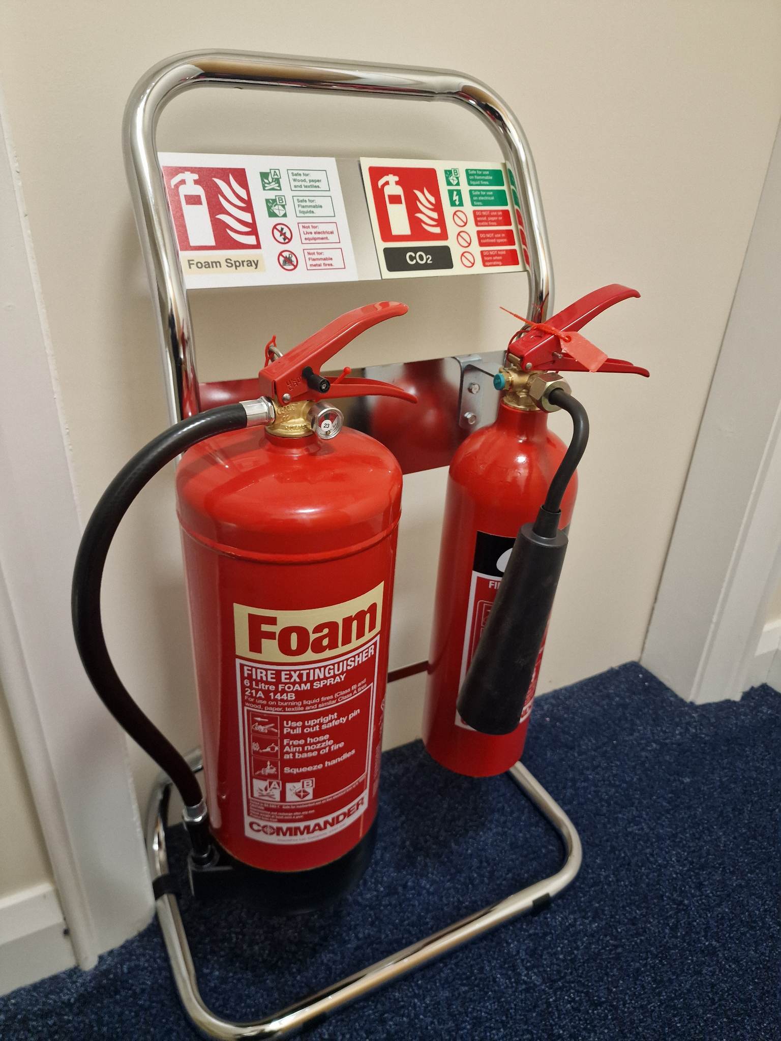A fire extinguisher on a wall